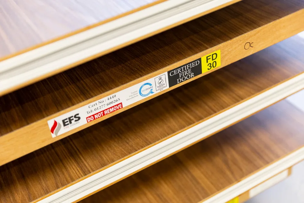Close-up of a certification label attached to an EFS timber fire door
